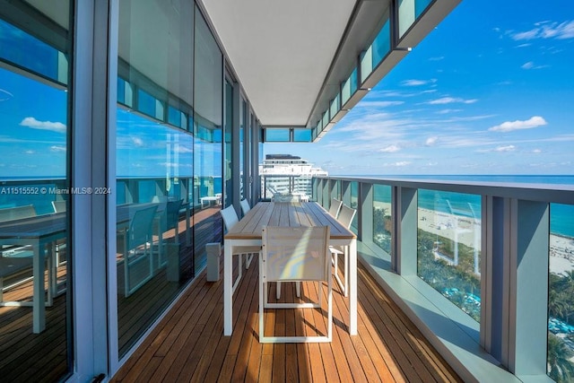 balcony featuring a water view