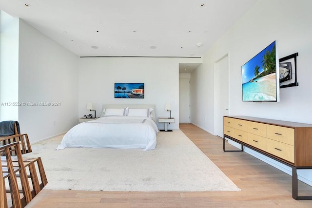 bedroom with light hardwood / wood-style flooring