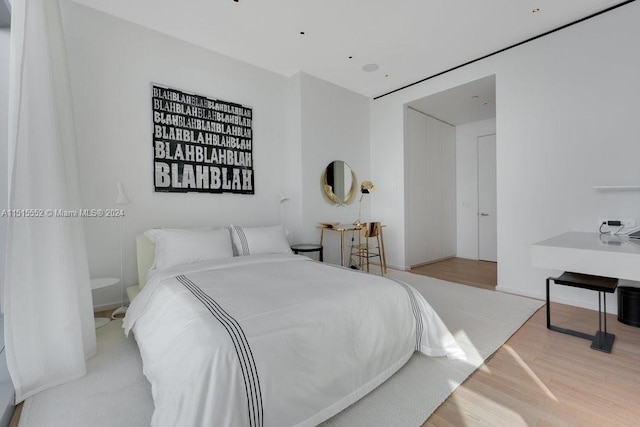 bedroom featuring light wood-type flooring