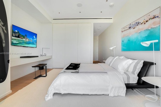 bedroom with light hardwood / wood-style flooring