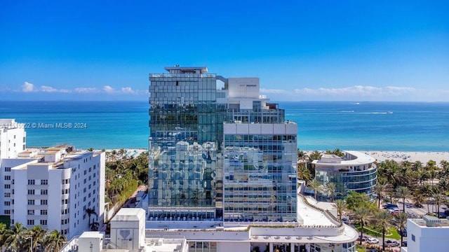 exterior space featuring a view of the beach and a water view