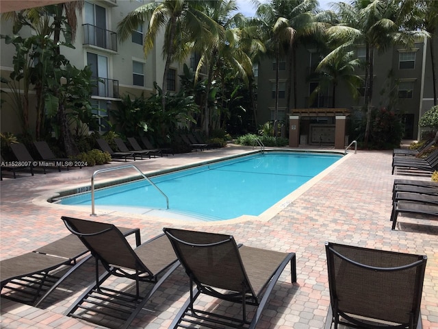 view of swimming pool featuring a patio