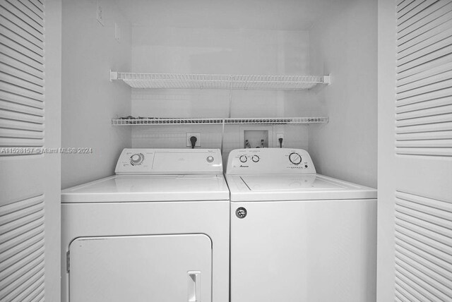 laundry area with separate washer and dryer