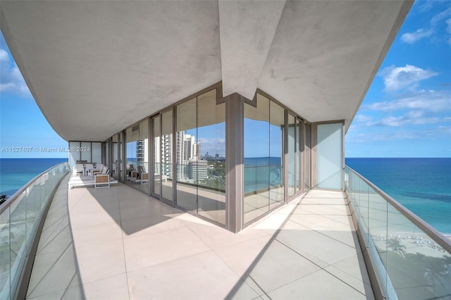 balcony featuring a water view