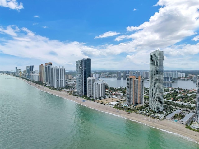 exterior space with a water view and a view of the beach