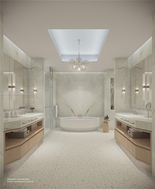 bathroom featuring a chandelier, vanity, a skylight, and walk in shower