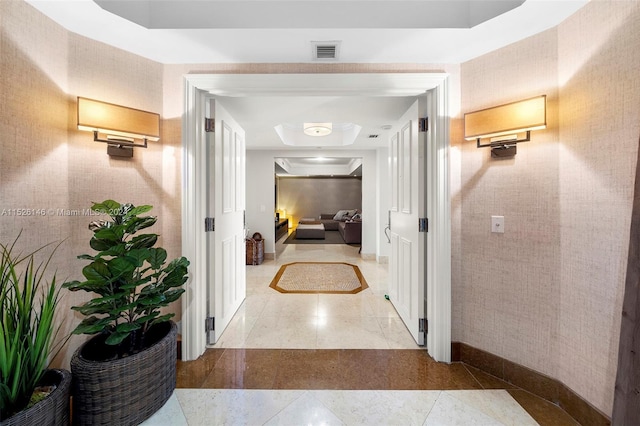 hallway with light tile floors