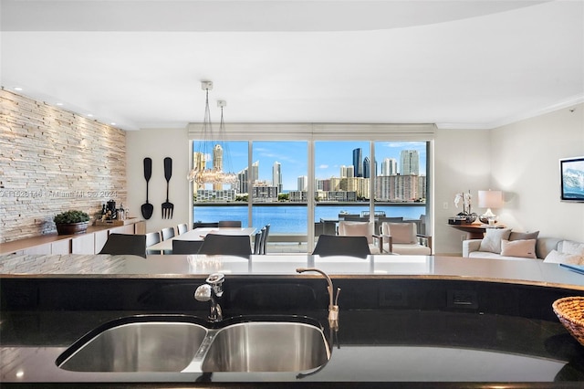 kitchen with decorative light fixtures and sink