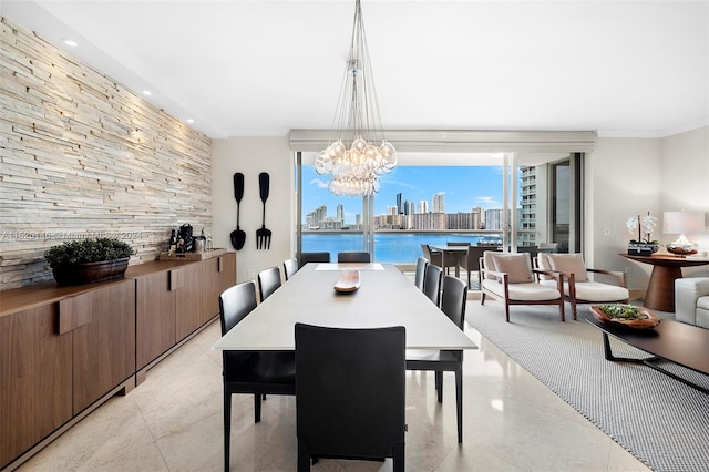 dining space featuring an inviting chandelier and light tile flooring