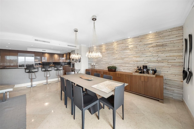 tiled dining room with a chandelier