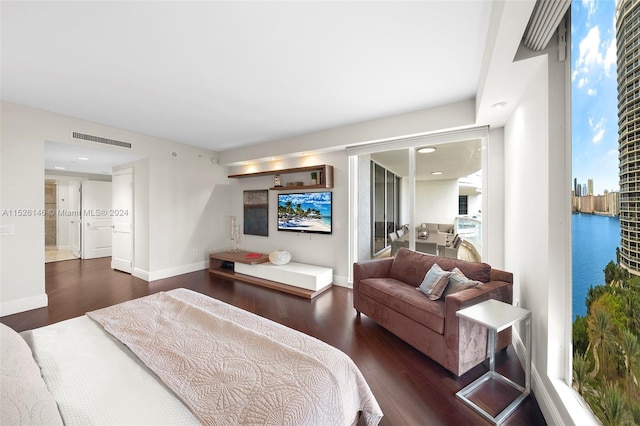 bedroom featuring dark hardwood / wood-style flooring