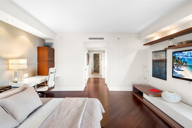 bedroom with dark wood-type flooring