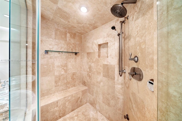 bathroom with tiled shower