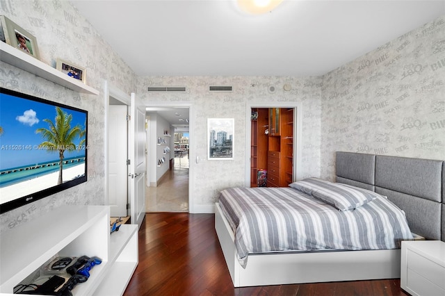 bedroom featuring dark hardwood / wood-style floors