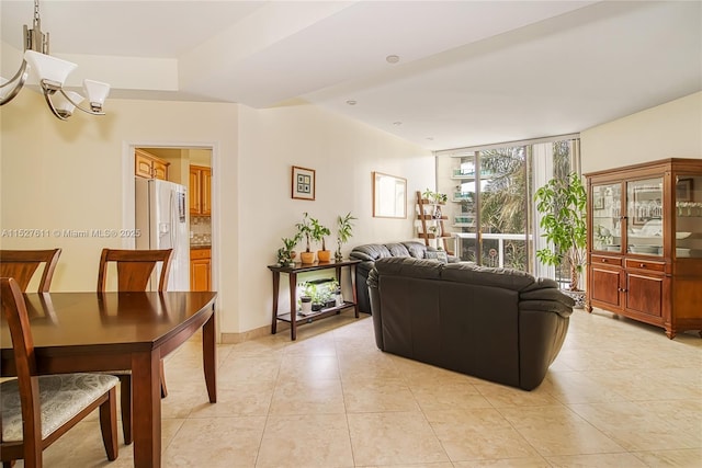 20185 E Country Club Dr Unit 202/203, Aventura, FL 33180 - living room with light tile patterned flooring, a chandelier, and a wall of windows