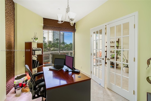 tiled office space featuring french doors and a chandelier