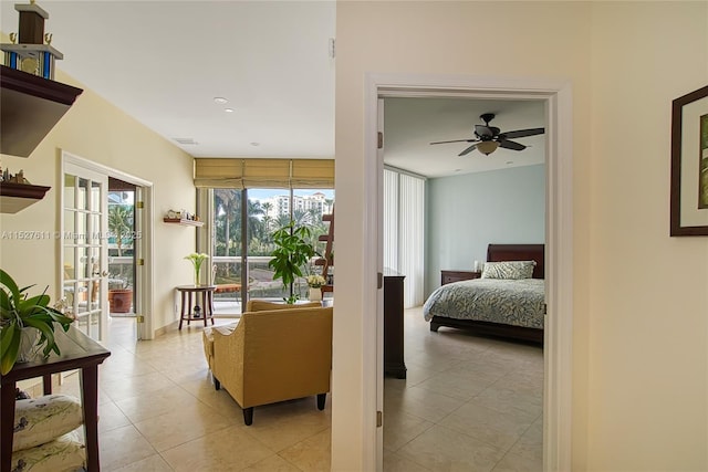 tiled bedroom featuring access to exterior and ceiling fan