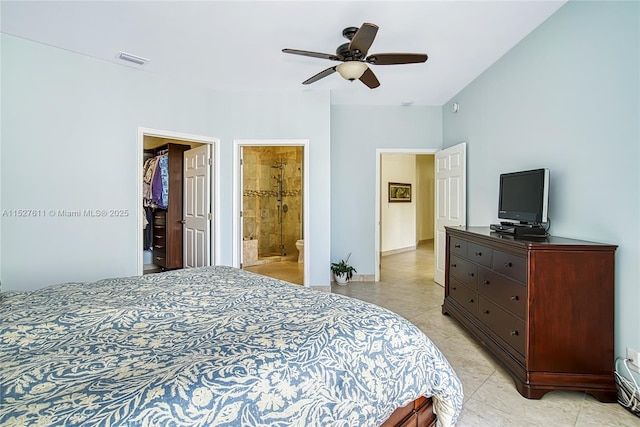 20185 E Country Club Dr Unit 202/203, Aventura, FL 33180 - bedroom with a spacious closet, connected bathroom, a ceiling fan, and light tile patterned floors