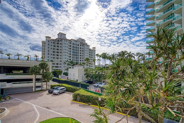 20185 E Country Club Dr Unit 202/203, Aventura, FL 33180 - view of building exterior featuring uncovered parking