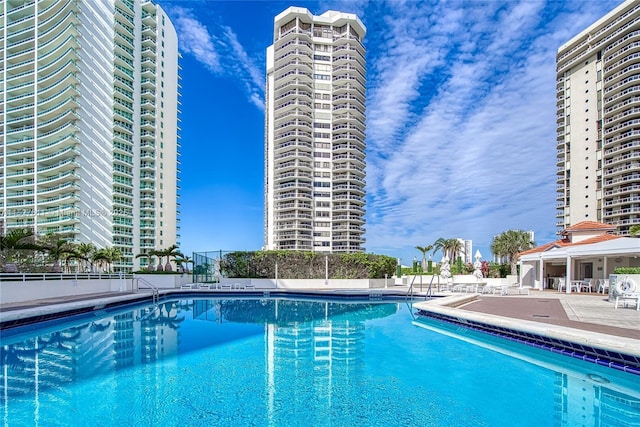 view of swimming pool featuring a patio area