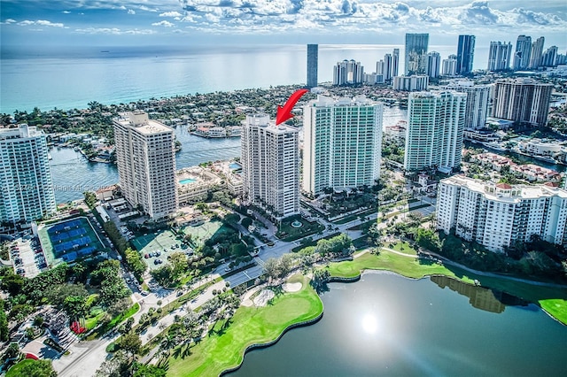 birds eye view of property with a water view