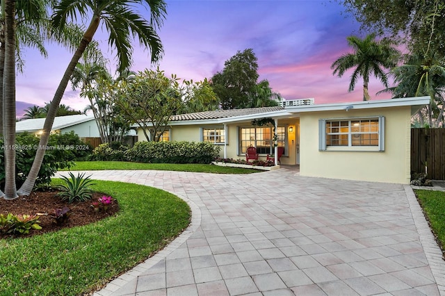 ranch-style house with a yard