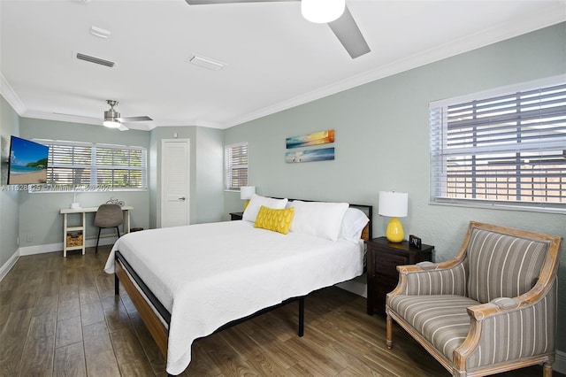 bedroom featuring dark hardwood / wood-style floors, ornamental molding, and ceiling fan