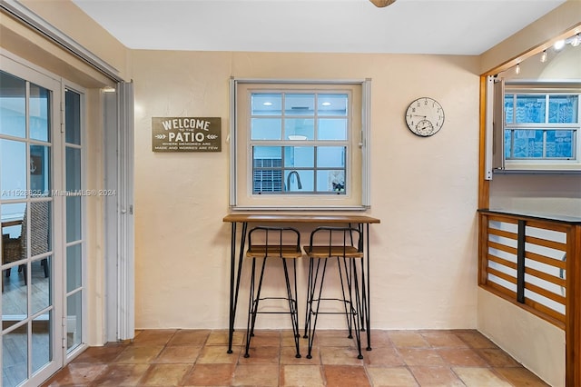 interior space featuring light tile floors and a wealth of natural light