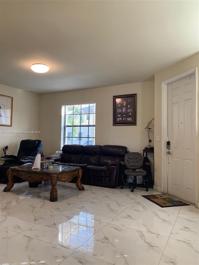 living room featuring light tile floors