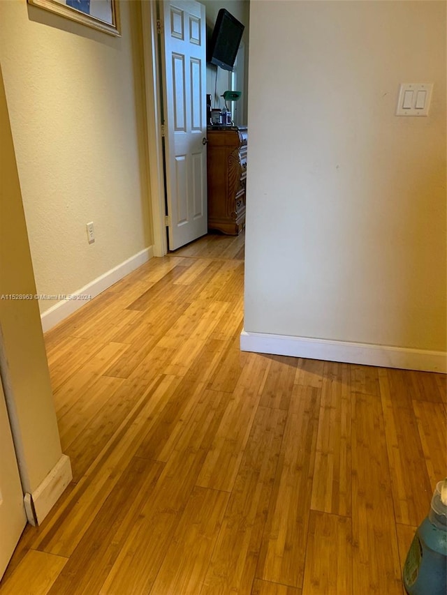 spare room featuring light wood-type flooring