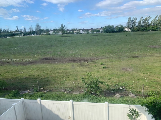 view of yard with a rural view