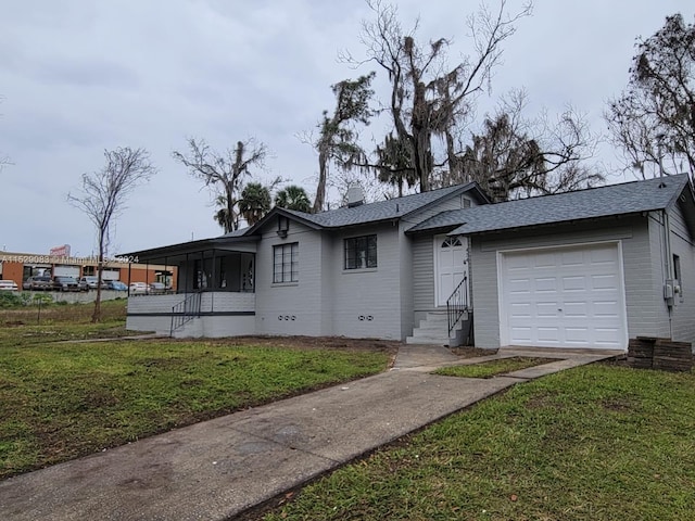 view of front of house with a garage and a front yard