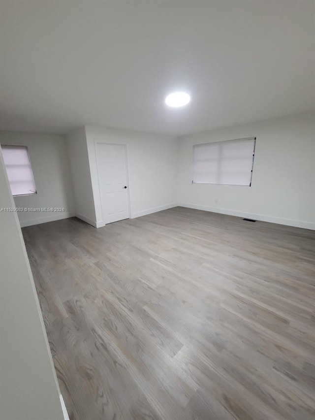 spare room with light hardwood / wood-style floors