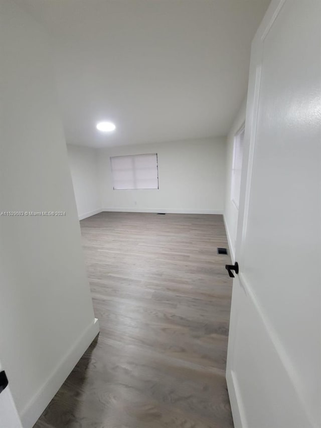 empty room with wood-type flooring