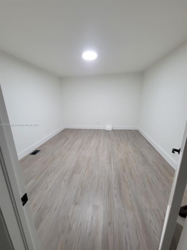 unfurnished room featuring light hardwood / wood-style floors