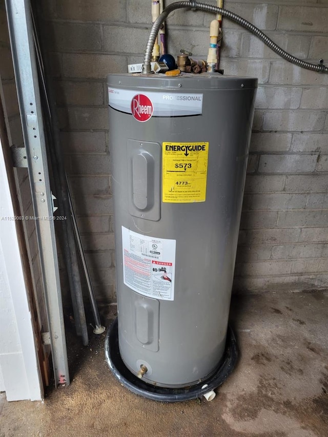 utility room with electric water heater