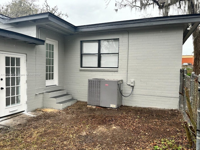 view of home's exterior with central AC unit