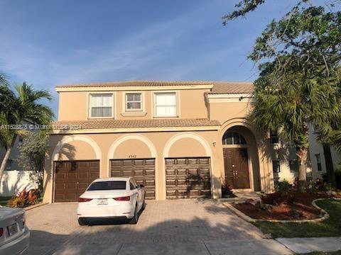 mediterranean / spanish house featuring a garage