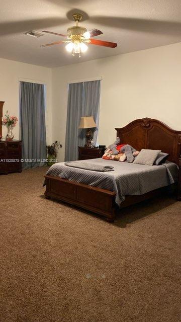 bedroom with carpet and ceiling fan