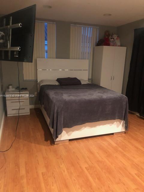 bedroom with light hardwood / wood-style flooring