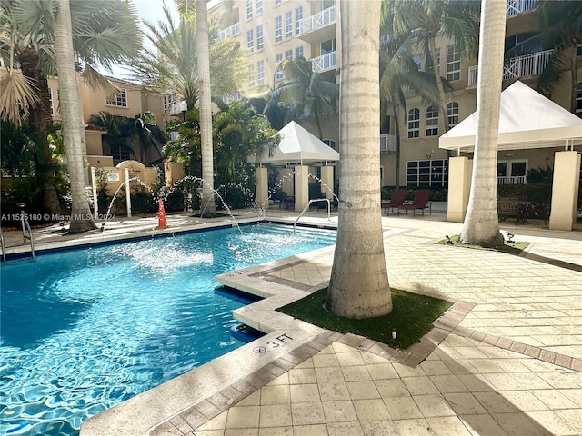 view of pool featuring a patio area