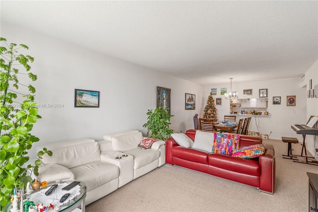 living room featuring light carpet, a textured ceiling, and a notable chandelier