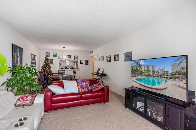 carpeted living room with a textured ceiling and a notable chandelier