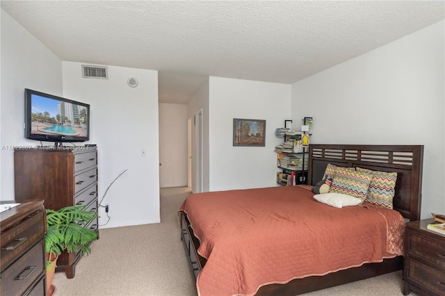 carpeted bedroom with a textured ceiling