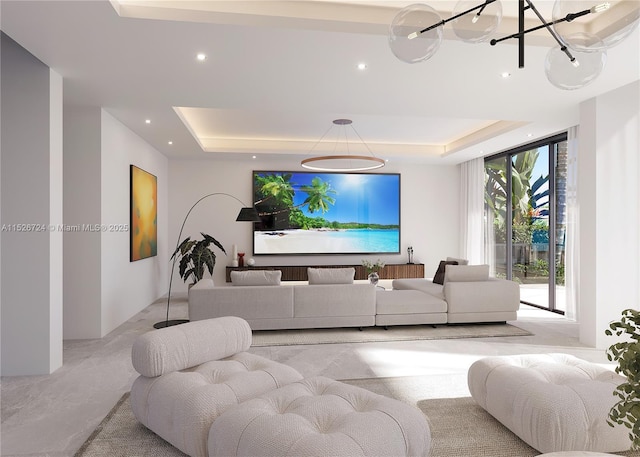 living room with a tray ceiling and floor to ceiling windows