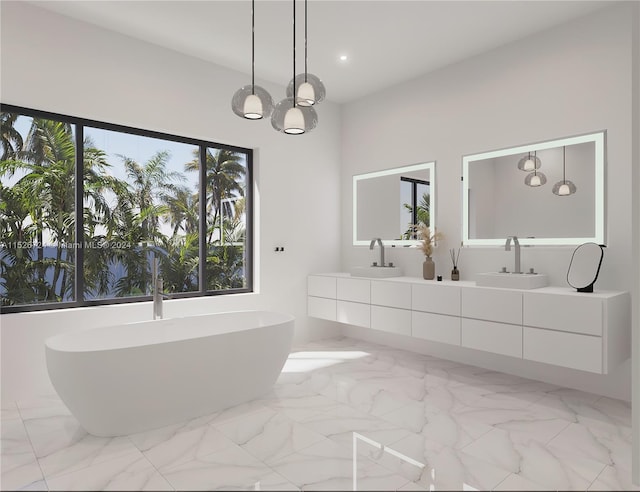 bathroom with a bathing tub, vanity, and an inviting chandelier