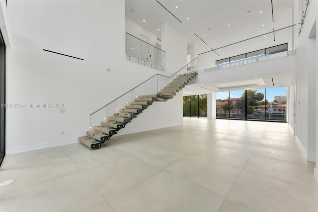 stairway with a towering ceiling