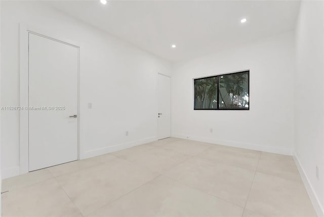 empty room featuring light tile patterned flooring