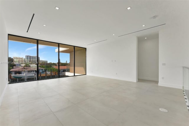 empty room featuring expansive windows