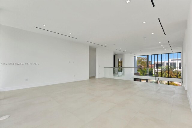 unfurnished living room featuring floor to ceiling windows